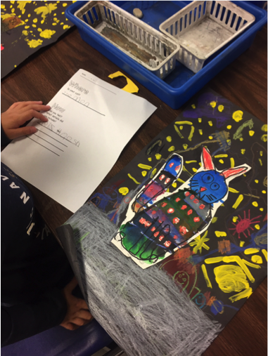 1st grade work on the details and background of their ?Night cat? collages.